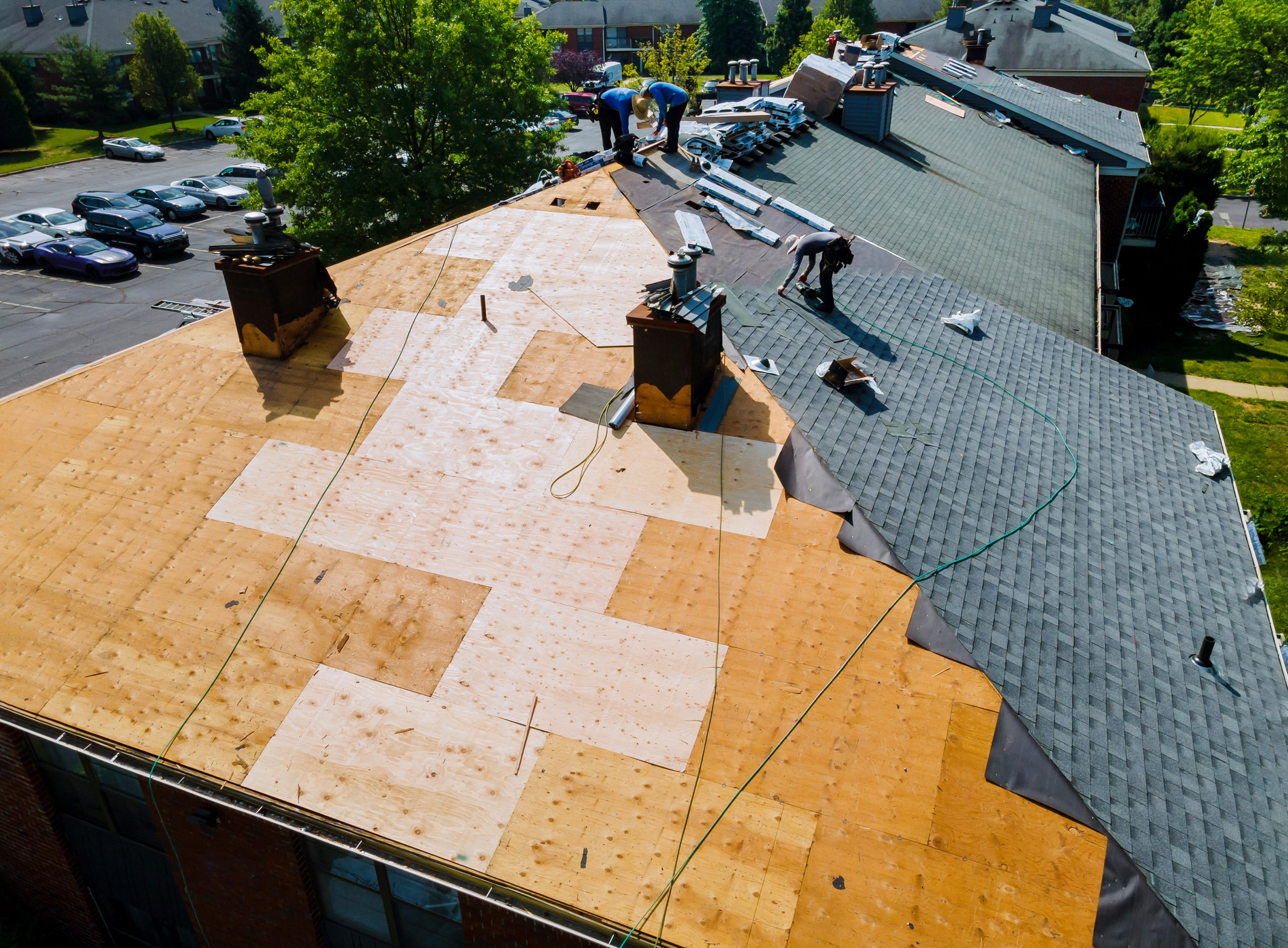 Roofing contractors finishing the installation of a new roof