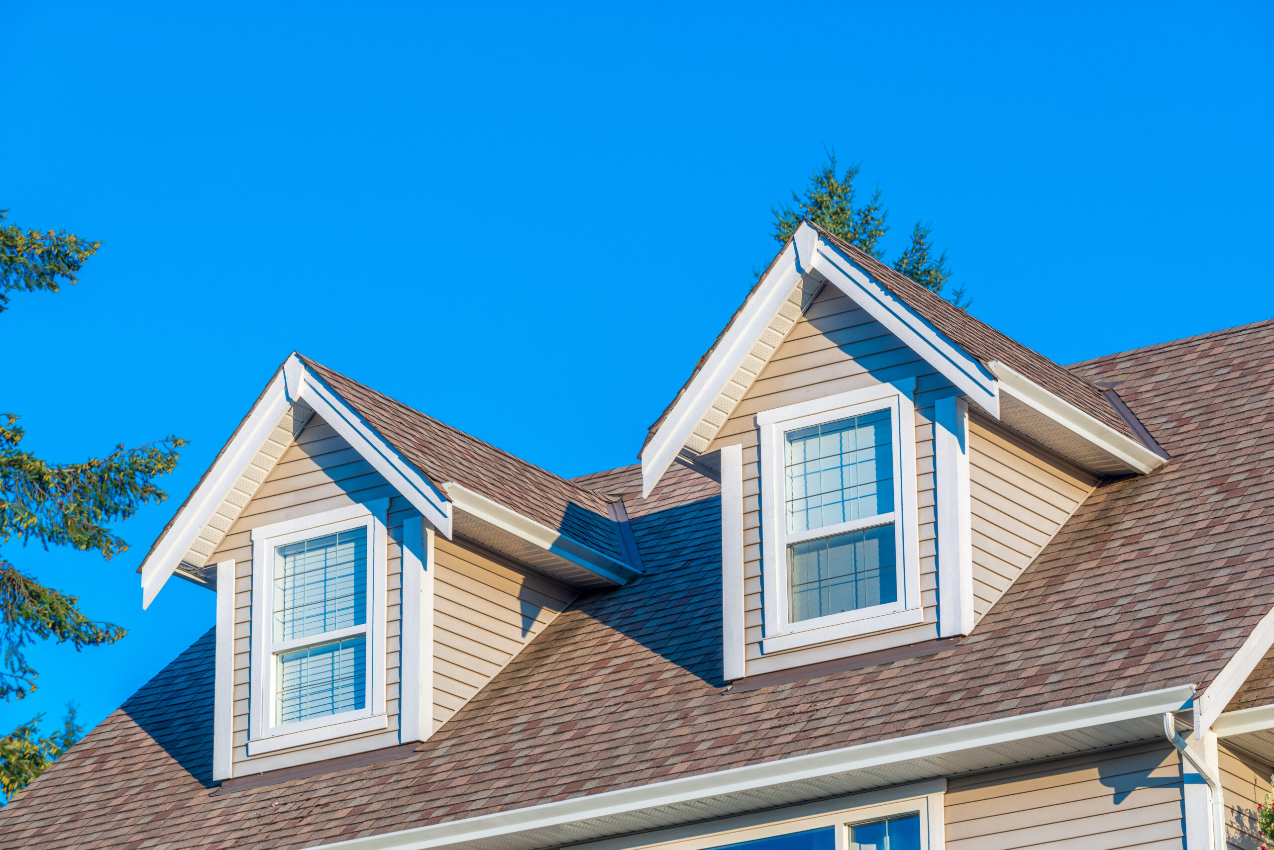 Close up of asphalt shingle roof on a two-story home