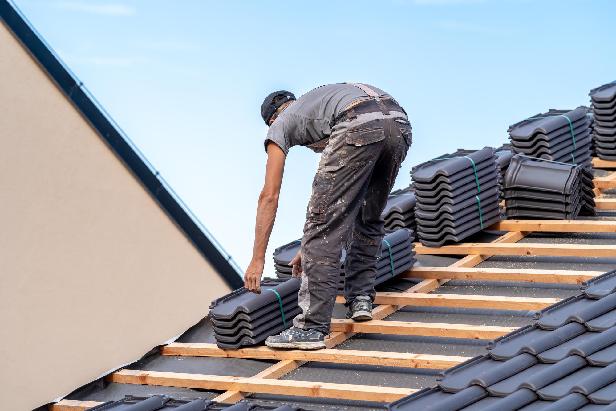 A close-up image of a metal roof stripped away by a storm