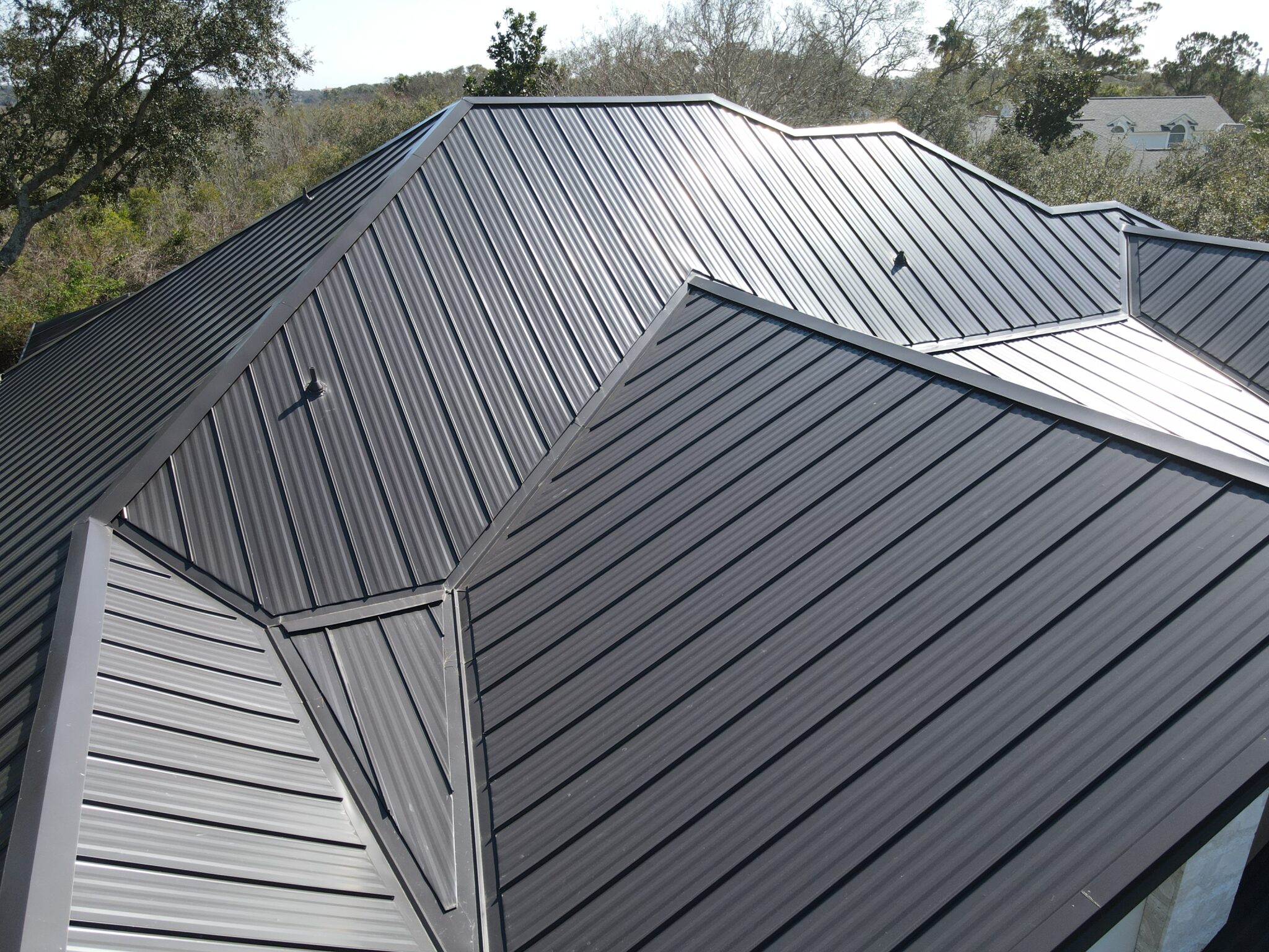 Rooftop view of a home with a metal roof