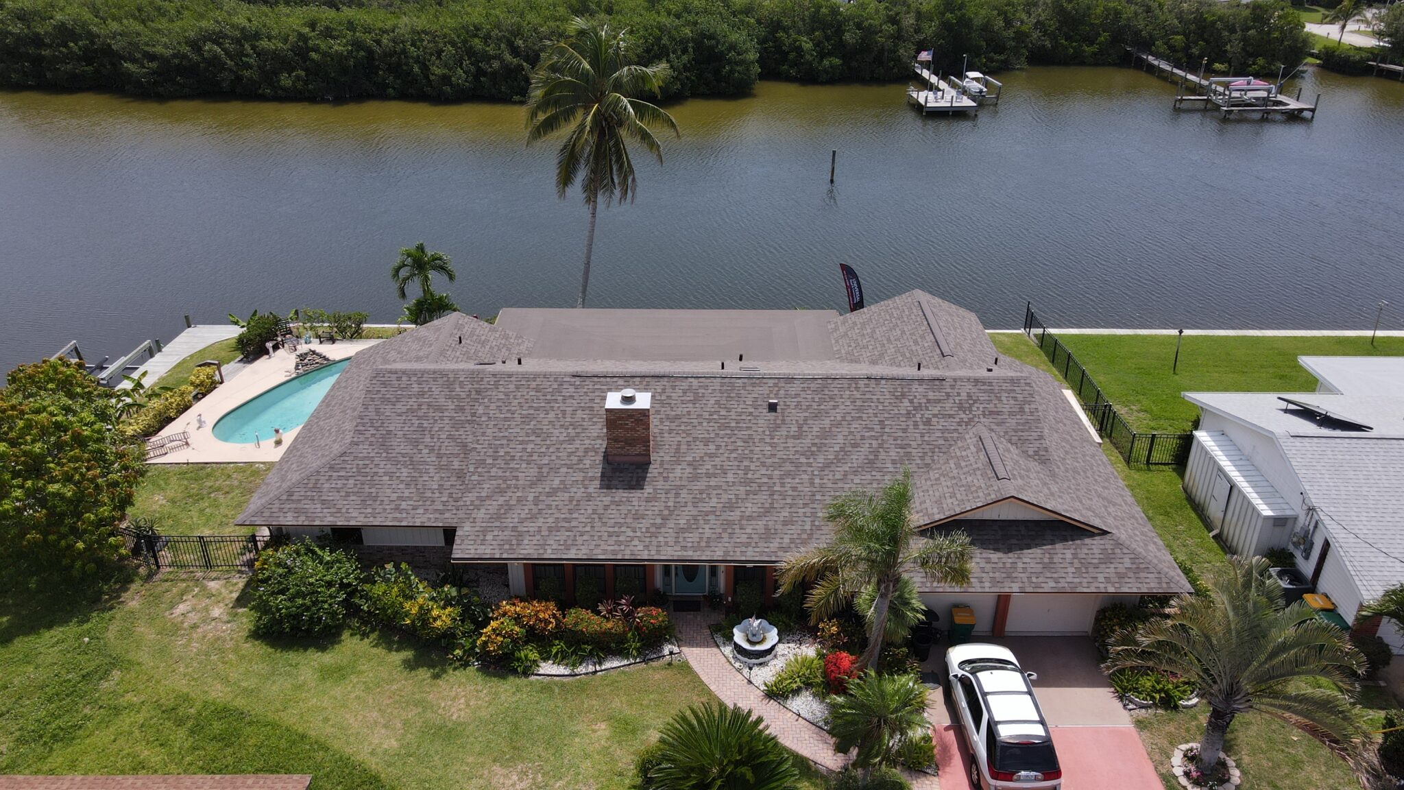 Aerial view of  a large home with asphalt shingle roofing