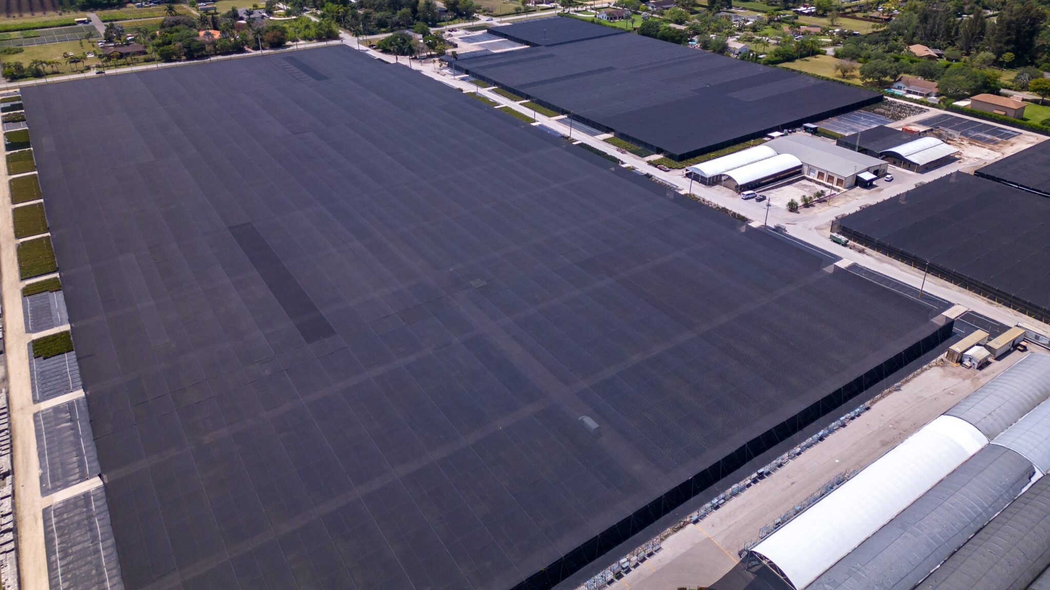 Large flat EPDM rubber roof on commercial building