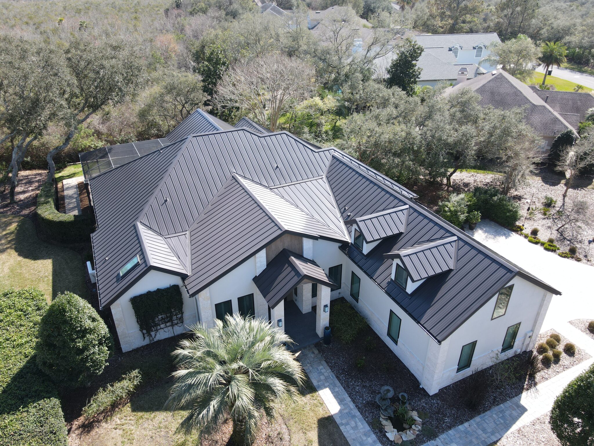 Black asphalt shingle roof on a neighborhood home