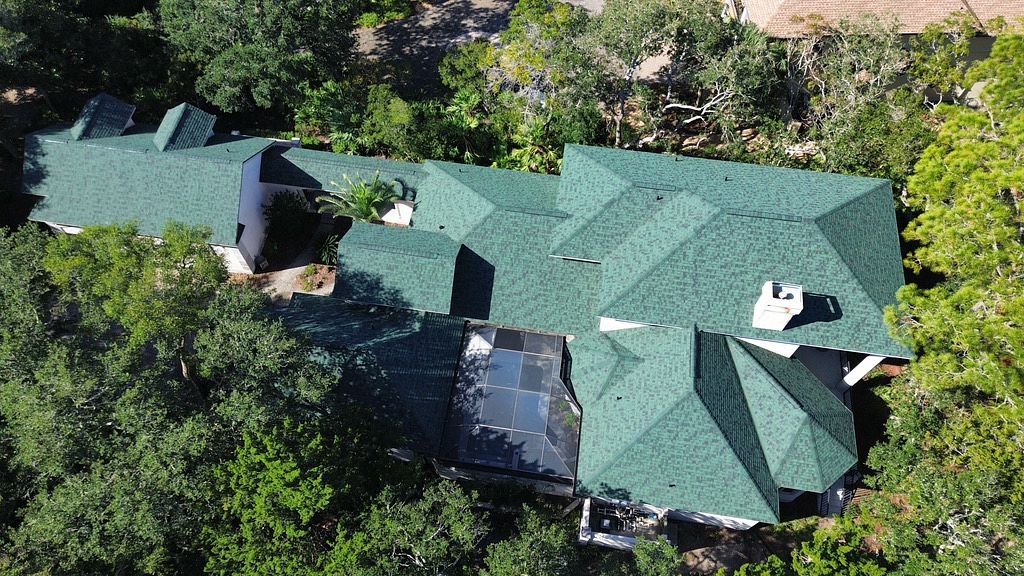 Large home with a gray asphalt shingle roof