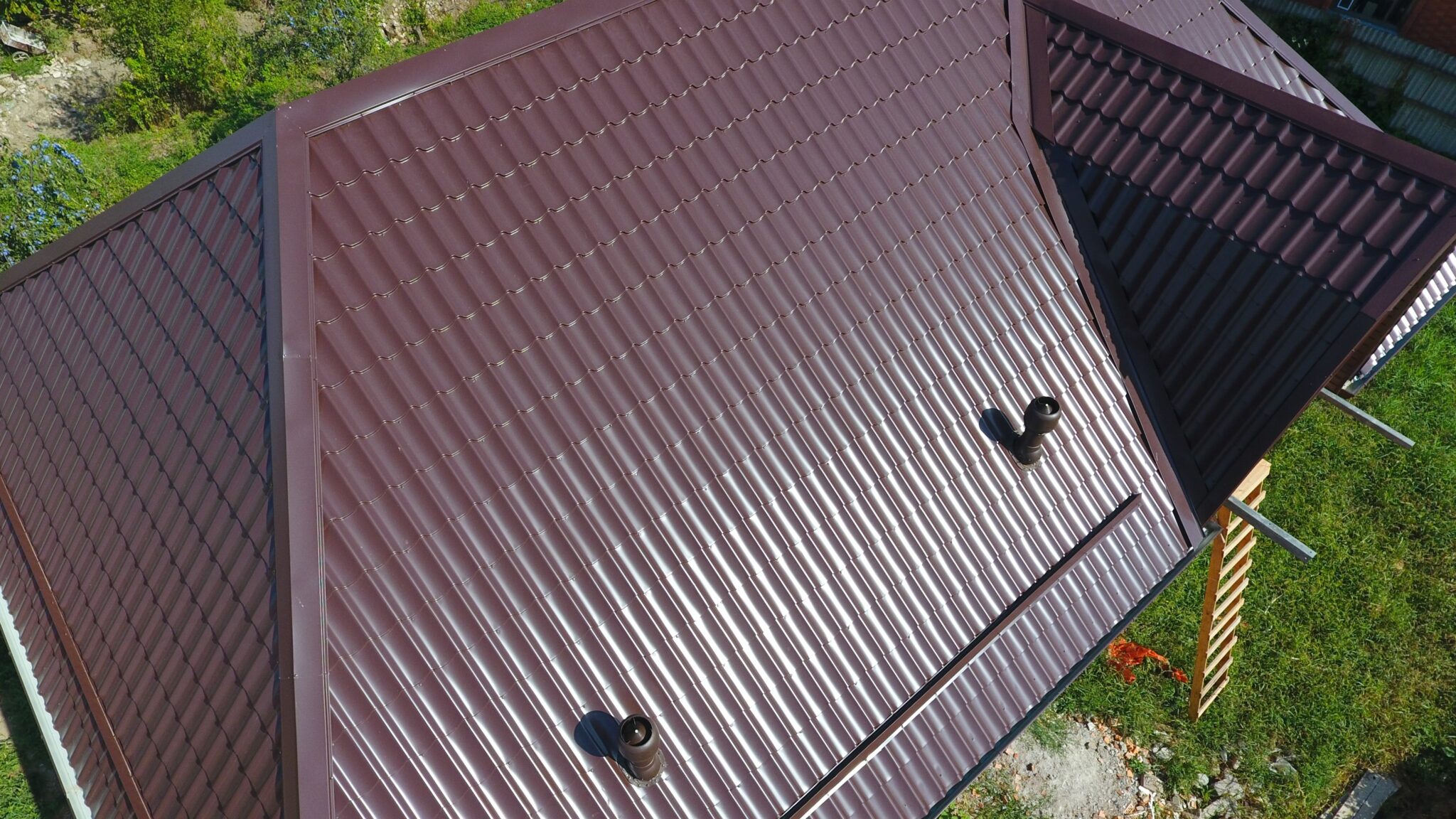 Large home with a dark metal roof on it