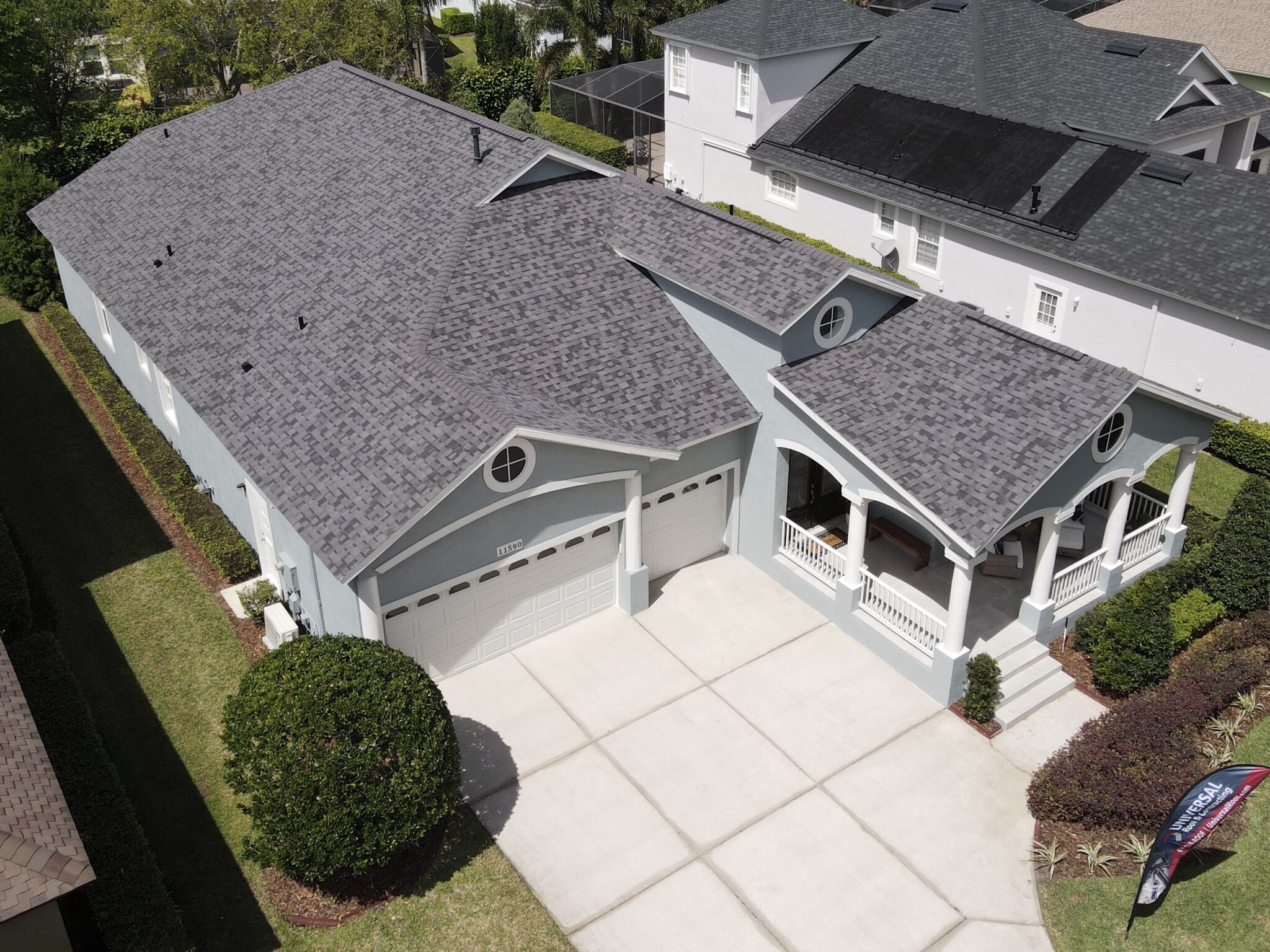 Aerial view of  a large home with asphalt shingle roofing