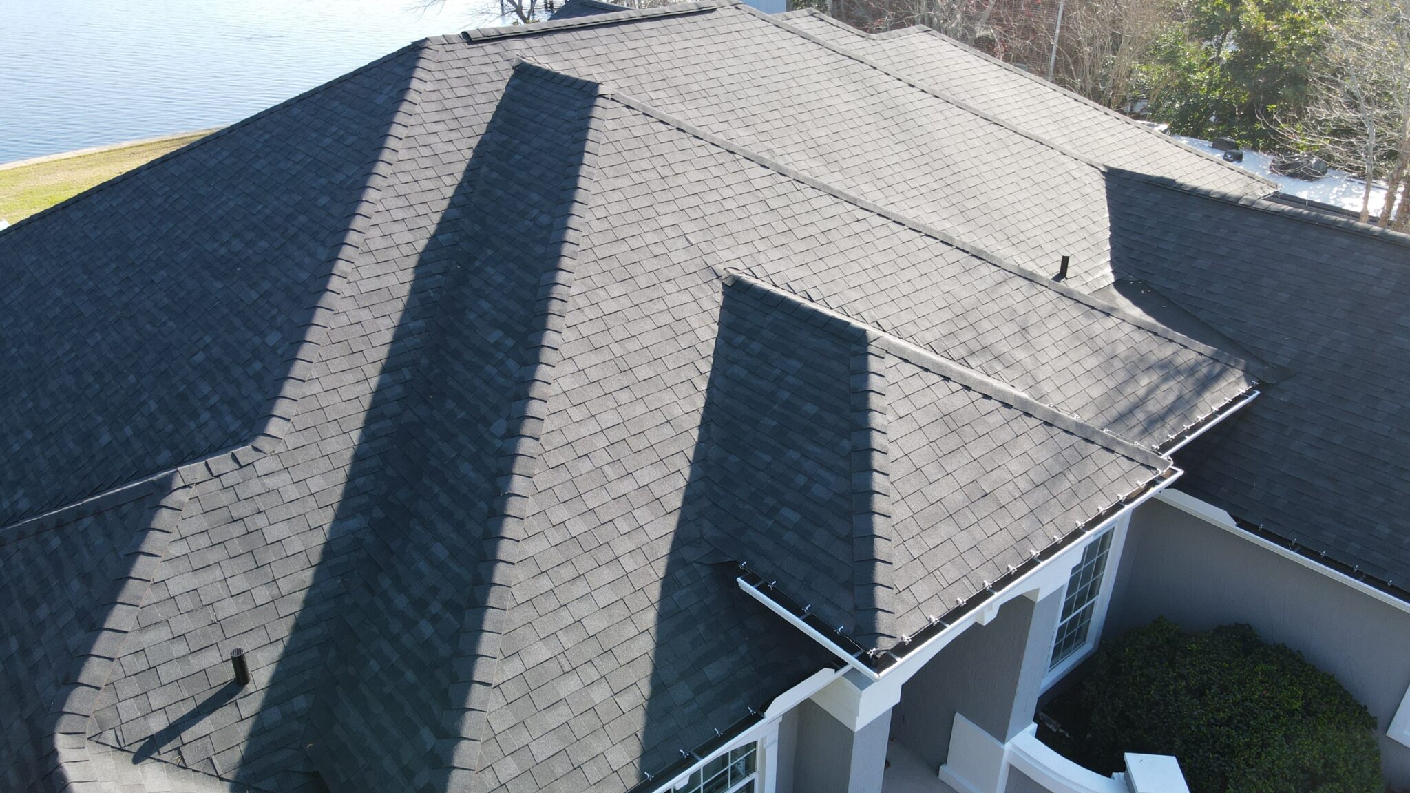 Home with dark asphalt shingle roof