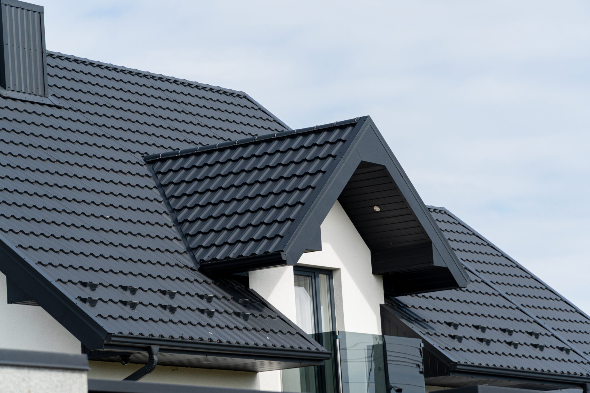A home with a beautiful new black roof.