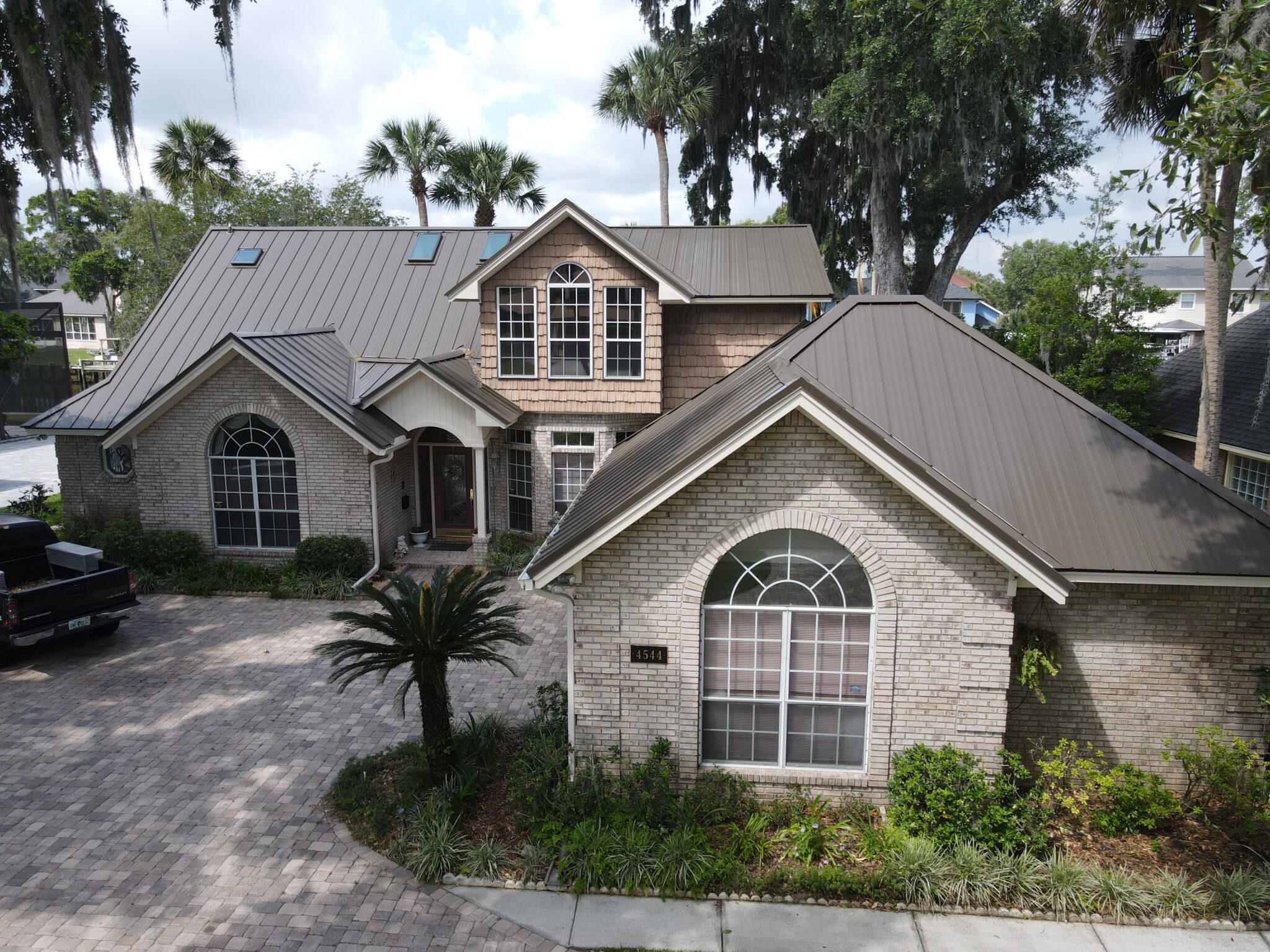 A Central Florida home with a neutral color palette and brown metal roof