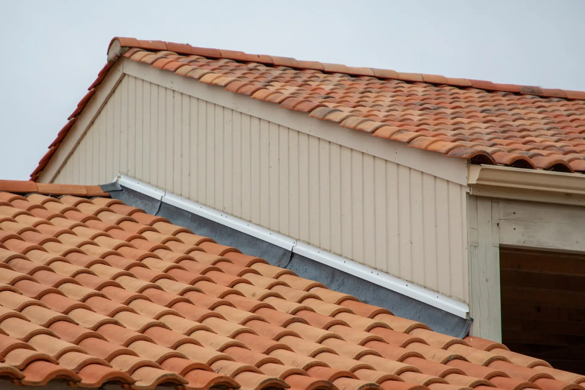 Roof tile replacement near me for flashing on a clay tile roof in Fernandina Beach, FL | Universal Roofing & Contracting